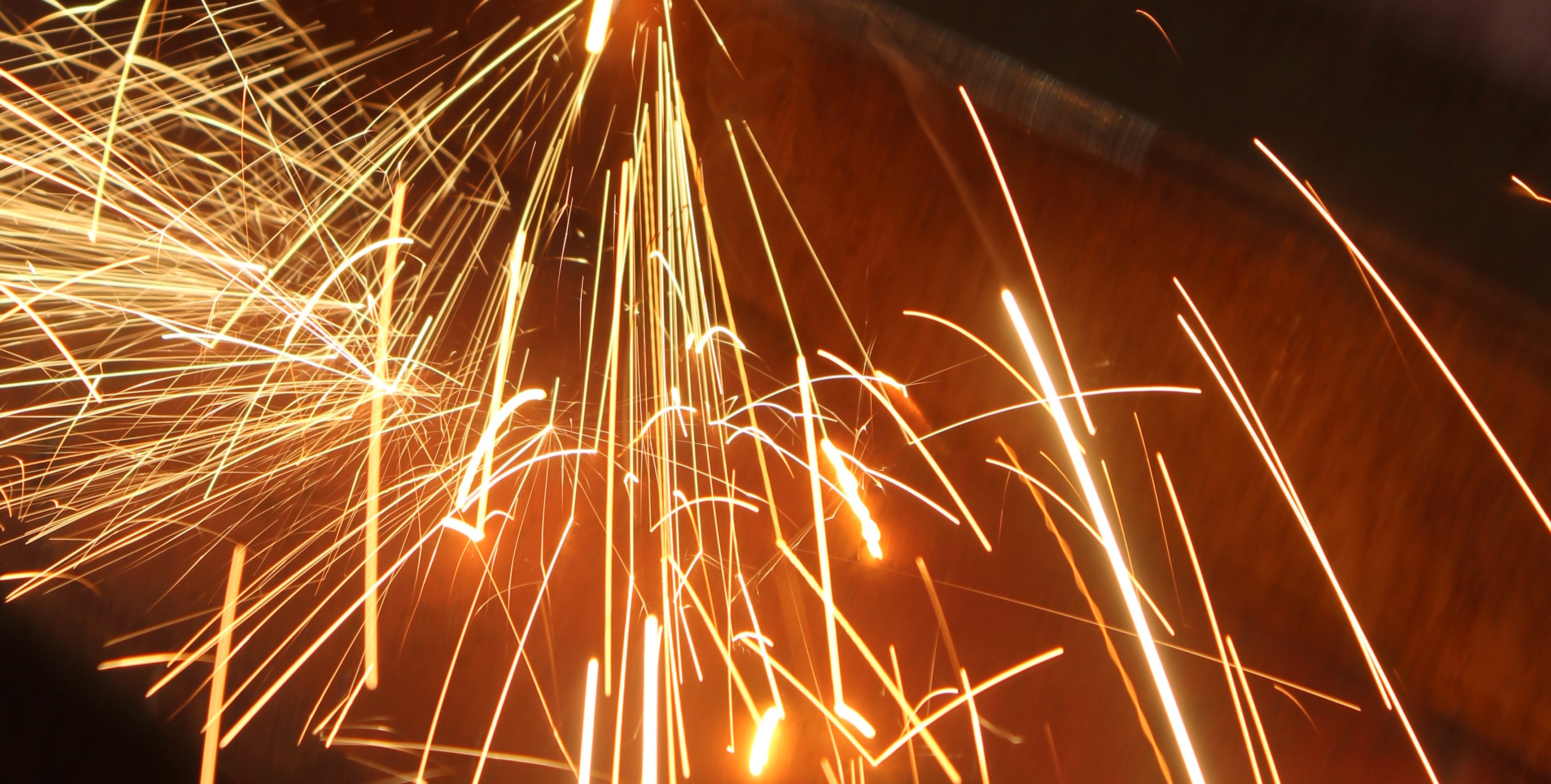 Metal sparks flying from the forge